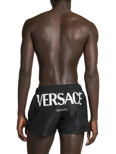 Shop Versace Logo Swim Shorts In Black