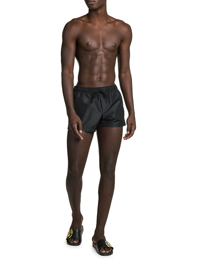 Shop Versace Logo Swim Shorts In Black