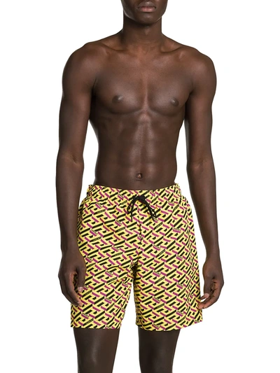 Shop Versace Men's Nylon Monogram Print Swim Trunks In Orange Peel Regal Blue