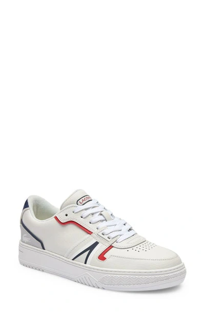 Shop Lacoste L001 Leather Sneaker In White/ Navy