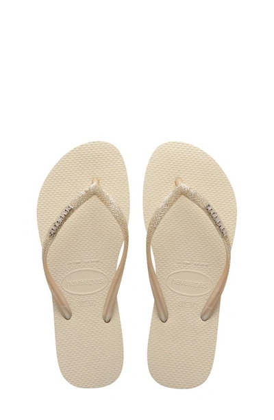 Shop Havaianas Slim Glitter Flip Flop In Beige