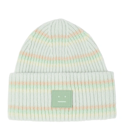 Shop Acne Studios Striped Wool Beanie In Green