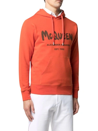 Shop Alexander Mcqueen Logo-print Hoodie In Yellow & Orange