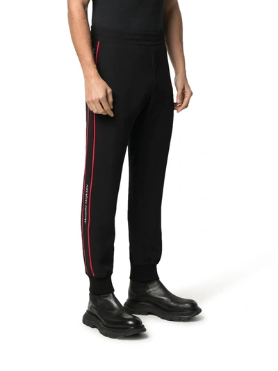 Shop Alexander Mcqueen Logo Tape Track Trousers In Black