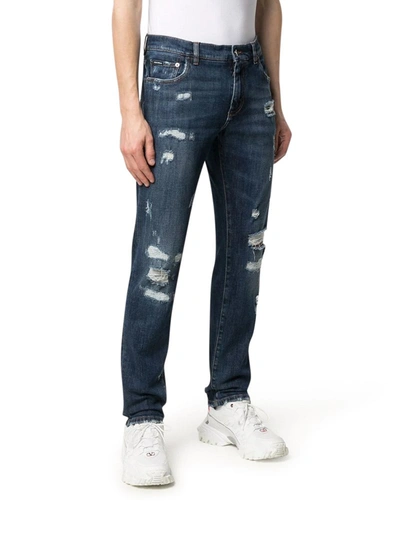 Shop Dolce & Gabbana Embossed Logo Ripped Slim-fit Jeans In Multicolour