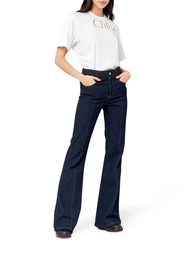 Shop Chloé Bootcut Style Flared Jeans In Recycled Stretch Denim With Weave At The Waist In Blue