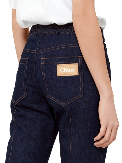 Shop Chloé Bootcut Style Flared Jeans In Recycled Stretch Denim With Weave At The Waist In Blue