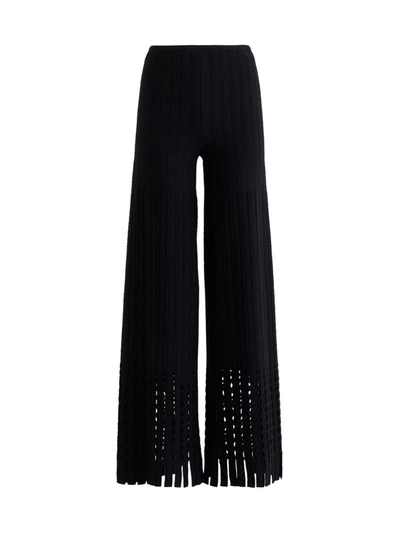 Shop Alaïa Flared Trousers In Perforated Knit In Black
