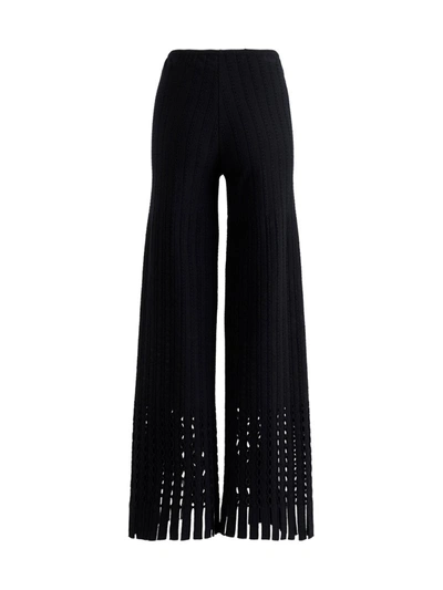 Shop Alaïa Flared Trousers In Perforated Knit In Black