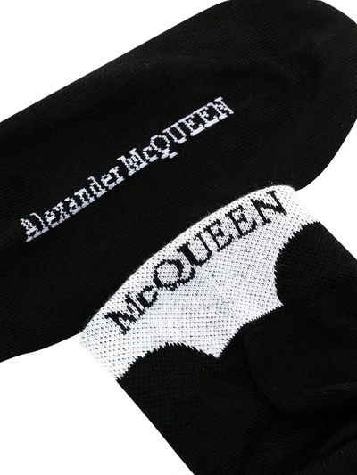Shop Alexander Mcqueen Logo-embroidered Socks In Black