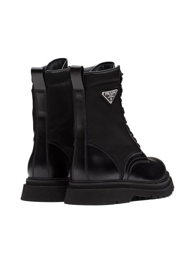 Prada Logo-plaque Panelled Ankle Boots In Black