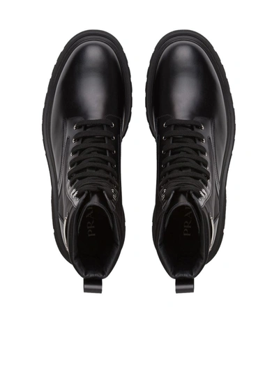 Prada Logo-plaque Panelled Ankle Boots In Black