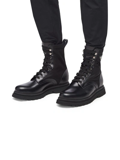 Prada Logo-plaque Panelled Ankle Boots In Black
