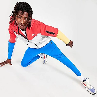 Shop Nike Tech Fleece Taped Jogger Pants In Signal Blue/black
