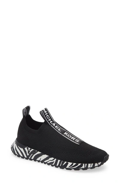 Shop Michael Michael Kors Bodie Slip-on Sneaker In Black/ Optic White