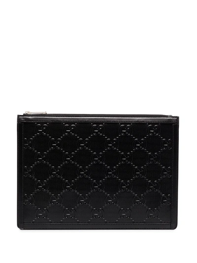 Shop Gucci Gg Embossed Pouch In Schwarz