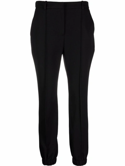 Shop Alexander Mcqueen Slim-cut Tailored Trousers In Black