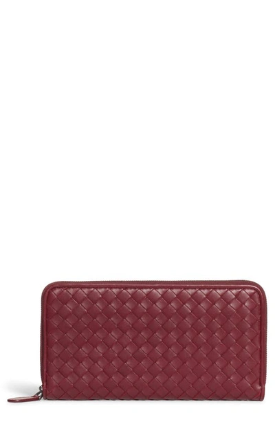 Shop Bottega Veneta Intreccio Zip Around Leather Wallet In Bordeaux