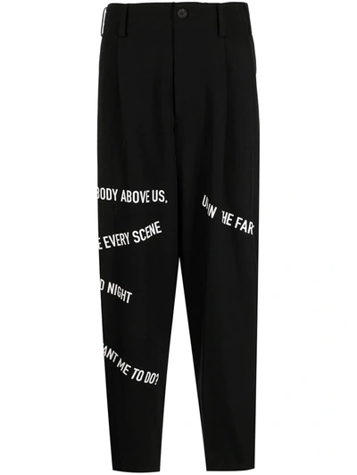 Shop Yohji Yamamoto Slogan-print Dropped-crotch Trousers In Black
