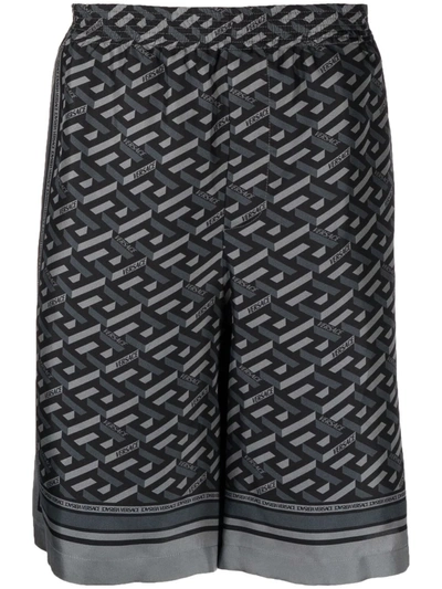 Shop Versace Greca-print Silk Shorts In Black