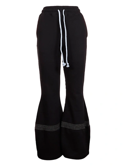 Shop Jw Anderson Flared Track Pants In 999