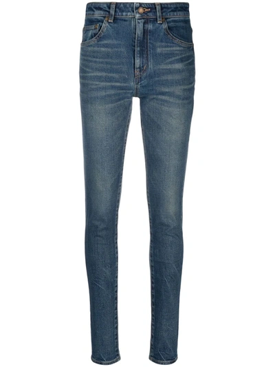 Shop Saint Laurent Whiskered Skinny Jeans In Blau