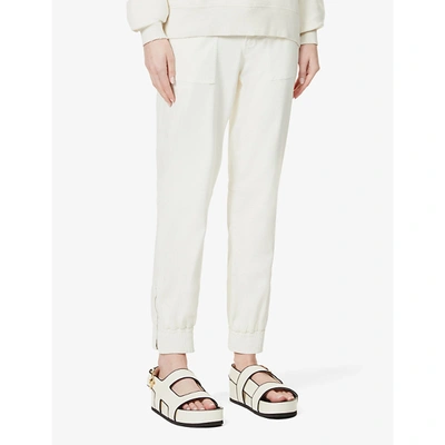 Shop J Brand Womens Angel White Arkin Tapered Mid-rise Cotton-blend Jogging Bottoms 28