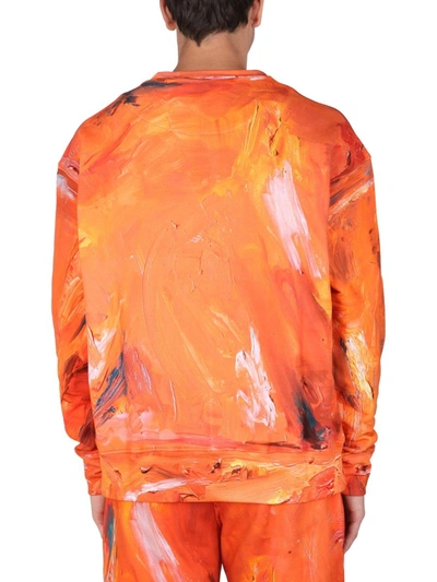 Shop Moschino "painting" Sweatshirt In Orange