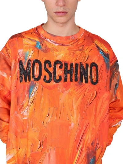 Shop Moschino "painting" Sweatshirt In Orange