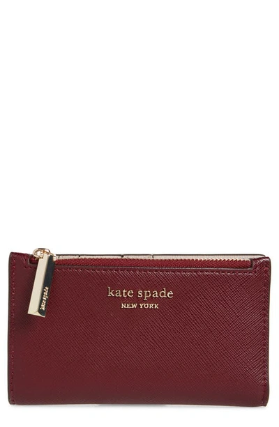 Shop Kate Spade Small Spencer Slim Leather Bifold Wallet In Grenache