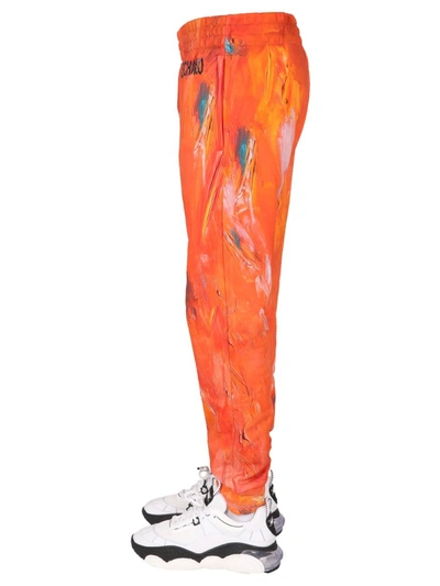 Shop Moschino "painting" Jogging Pants In Orange