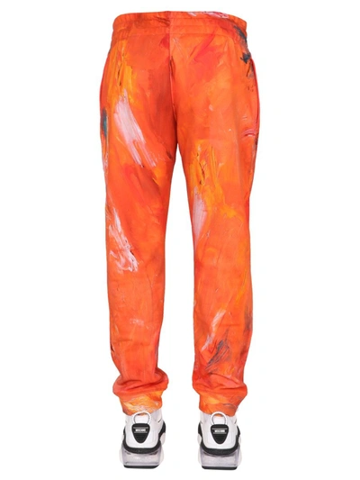 Shop Moschino "painting" Jogging Pants In Orange