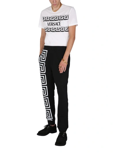 Shop Versace T-shirt With Greek Print In White