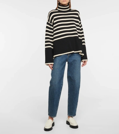 Shop Totême Striped Turtleneck Wool-blend Sweater In Black Stripe