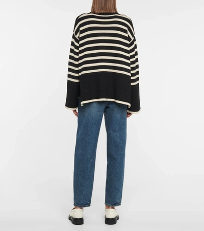 Shop Totême Striped Turtleneck Wool-blend Sweater In Black Stripe