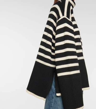 Shop Totême Striped Turtleneck Wool-blend Sweater In Black Stripe