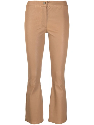 Shop Arma Flared Leather Trousers In Neutrals