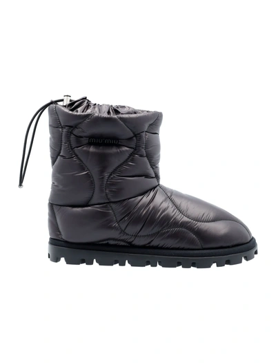 Shop Miu Miu Quilted Padded Boots In Black