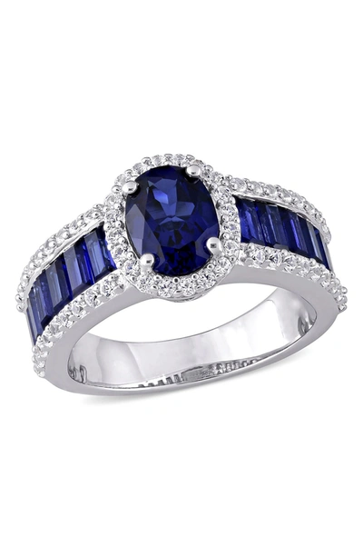 Delmar Sterling Silver Created Blue Sapphire Oval & Created White Sapphire Halo Baguette Band Ring In Blue