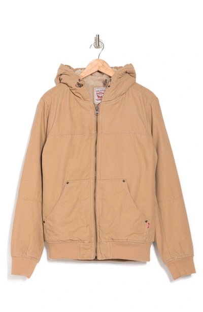 Shop Levi's Workwear Cotton Canvas Faux Shearling Lined Hoodie Bomber Jacket In Tan