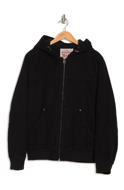 Shop Levi's Workwear Cotton Canvas Faux Shearling Lined Hoodie Bomber Jacket In Black