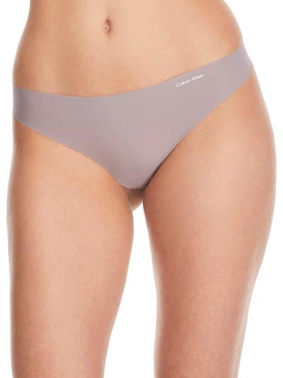 Shop Calvin Klein Invisibles Thong In Mink
