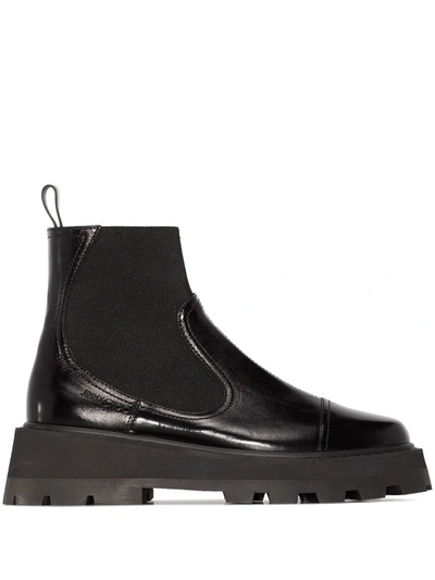 Shop Jimmy Choo Clayton Chunky Sole Chelsea Boots In Schwarz