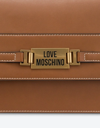 Shop Love Moschino Plaque Shoulder Bag In Leather