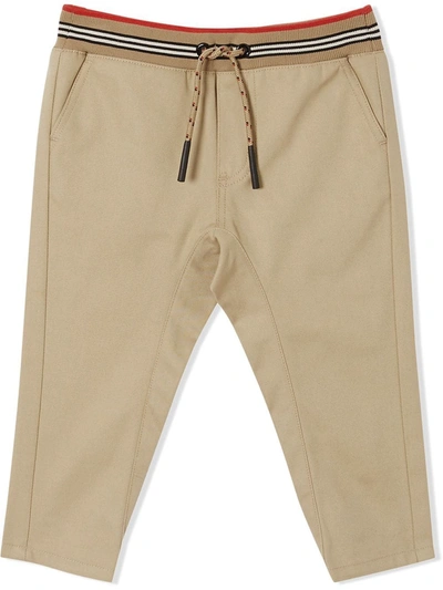 Shop Burberry Icon Stripe Twill Trousers In Brown