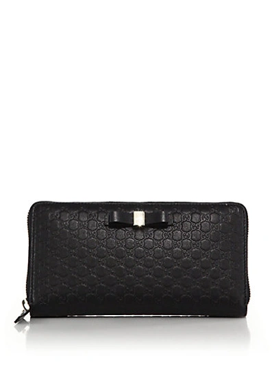Shop Gucci Bow Microssima Leather Zip-around Wallet In Black