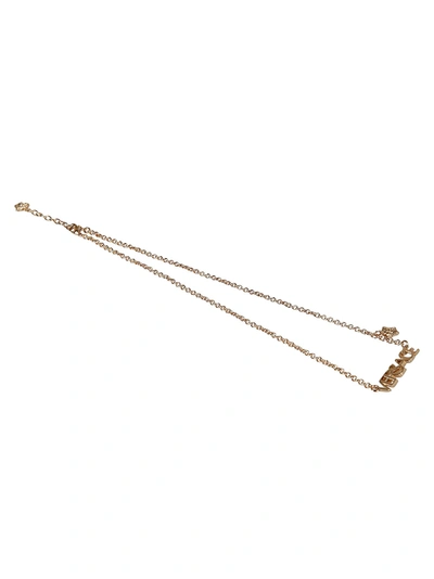 Shop Versace Logo Pendant Necklace In Gold