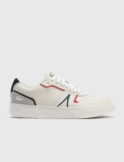 Shop Lacoste L001 Leather Trainers In White