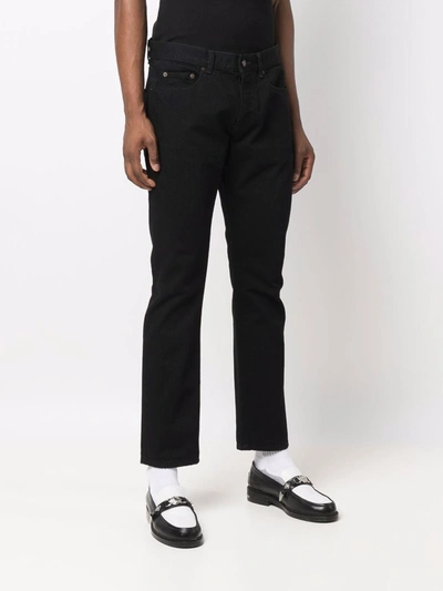 Shop Saint Laurent Cotton Straight-leg Jeans In Black