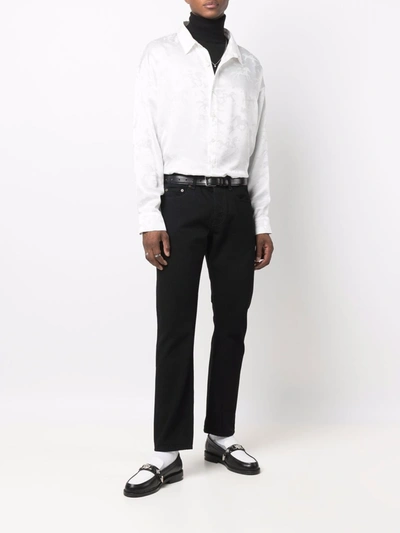 Shop Saint Laurent Cotton Straight-leg Jeans In Black